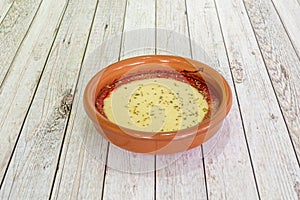 provoleta is a wheel of provolone cheese that is a tradition in Argentina photo