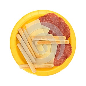 Provolone cheese slices and genoa salami plus breadsticks photo