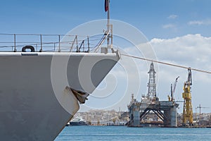 Prow of gray Battleship frigate docked in the grand harbor