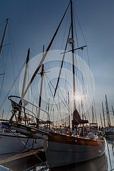 Prow and masts at twilight photo
