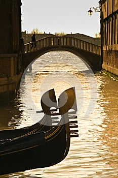 Prows of two gondolas in Venice