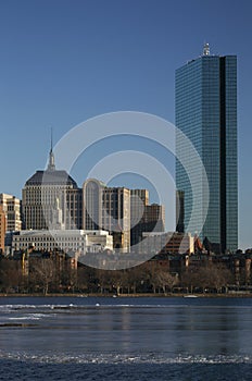 Prudential Building and Boston Skyline in winter on half frozen Charles River, Massachusetts, USA