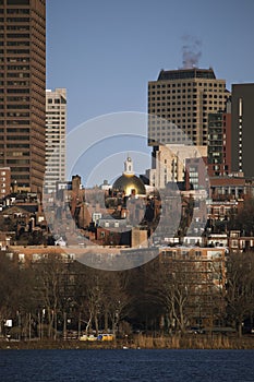 Prudential Building, State House and Boston Skyline in winter on half frozen Charles River, Massachusetts, USA