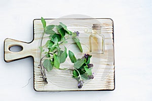 Prunella vulgaris, self-heal, carpenter's herb purple flower tincture on wooden cutting board ready for drying and