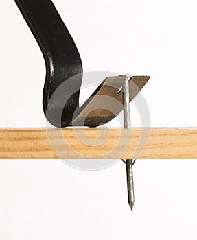 A pry bar removing a nail