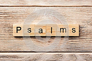 Psalms word written on wood block. psalms text on table, concept photo