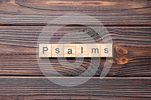 Psalms word written on wood block. psalms text on table, concept photo
