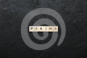 psalms word written on wood block. psalms text on table, concept photo