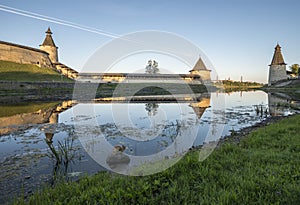 Pskov Kremlin from the side of the Pskova river at sunrise.