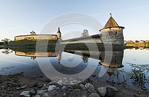 Pskov Kremlin from the side of the Pskova river at sunrise.