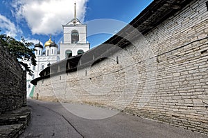 Pskov Kremlin wall wth Trinity Cathedral and belltower. Pskov, R