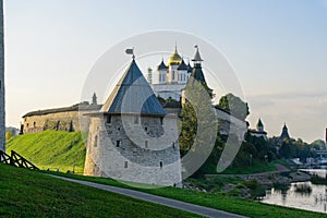 Pskov, Russia, September 11, 2023. The domes of the cathedral above the walls and towers of the fortress.
