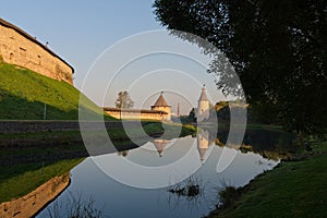 Pskov, Russia, September 11, 2023. View of the wall towers from the park at dawn.