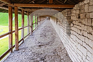 Pskov, Russia, September 6, 2023. View of a wooden gallery along the fortress wall.