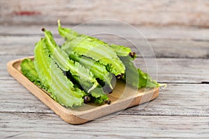 Psophocarpus tetragonolobus, Winged Bean on wood table