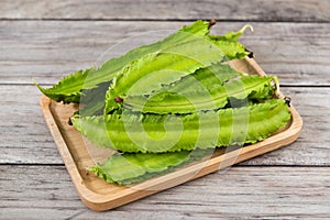 Psophocarpus tetragonolobus, Winged Bean on wood table