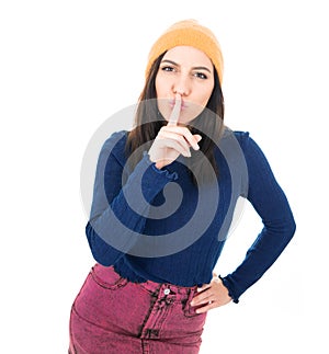 Psst. Young woman holding finger on lips, keep the secret concept, isolated on white background photo