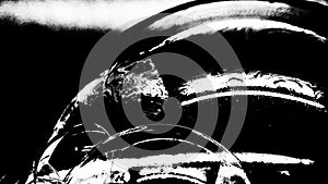 Psychedelic abstract formed by light interference on the surface of a soap bubble. Black and white