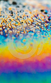 Psychedelic abstract planet from soap bubble, Light refraction on a soap bubble, Macro Close Up moving particles Rainbow colors on