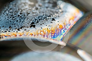 Psychedelic abstract planet from soap bubble, Light refraction on a soap bubble, Macro Close Up moving particles Rainbow colors on