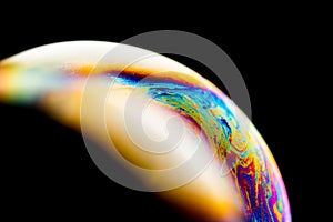 Psychedelic abstract planet from soap bubble, Light refraction on a soap bubble, Macro Close Up moving particles Rainbow colors on