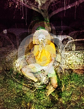 Psychedelic glitch horror skull mask man on abandoned car background