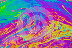 Psychedelic multicolored patterns background. Photo macro shot of soap bubbles