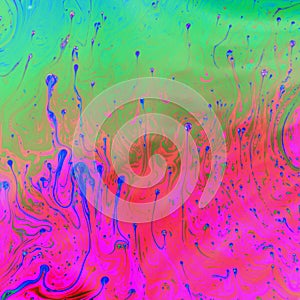 Psychedelic pink, green and blue trippy abstract background