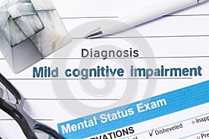 Psychiatric Diagnosis Mild Cognitive Impairment. Medical book or form with the name of diagnosis Mild Cognitive Impairment is on t