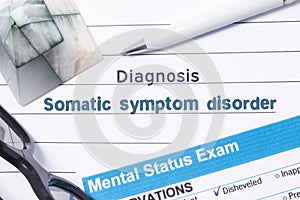 Psychiatric Diagnosis Somatic Symptom Disorder. Medical book or form with the name of diagnosis Somatic Symptom Disorder is on tab