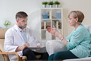 Psychiatrist listening his female patient photo