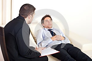 Psychiatrist with male patient photo