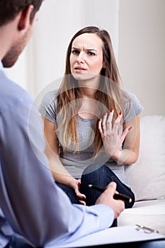 Psychiatrist talking with his young patient