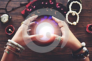 Psychic readings and clairvoyance concept Crystal ball fortune teller hands and Tarot cards reading divination