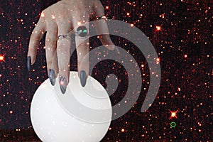 Psychic readings and the concept of clairvoyance. Fortune telling on a crystal ball. Elements of this image furnished by NASA