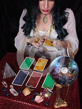 Psychic With Tarot Cards and Crystal Ball