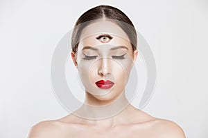 Psychic. Woman with 3 third eye looking at you camera concentrating thinking with mind and heart intuition about problem isolated