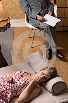 Psychoanalyst talking with nymphomaniac woman photo