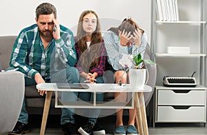 Psychological parents problem. Trouble couple with unhappy child teenager discussing problems in worry family. Conflicts