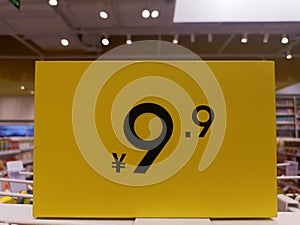 The psychological price of 9.9 is written on an earthy yellow label