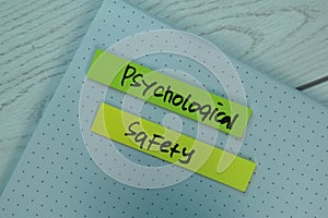 Psychological Safety write on sticky notes isolated on office desk