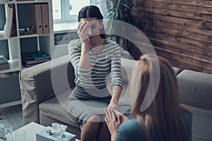 Psychologist having session with her patient in her private consulting room