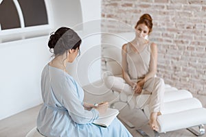 Psychologist having session with her patient in office