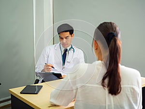 Psychologist metal health concept. Psychologist and depressed patient at office during consultation, The male doctor is treating