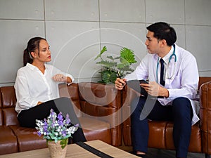 Psychologist metal health concept. Psychologist and depressed patient at office during consultation, The male doctor is treating