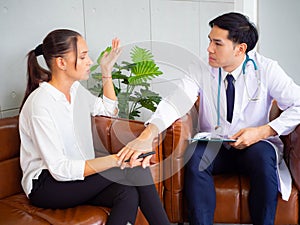 Psychologist metal health concept. Psychologist and depressed patient at office during consultation, The male doctor is treating