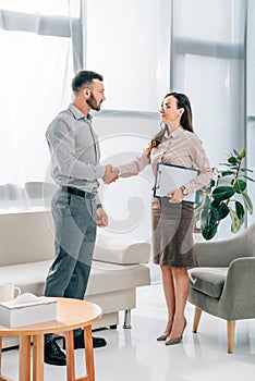 psychologist and patient shaking hands