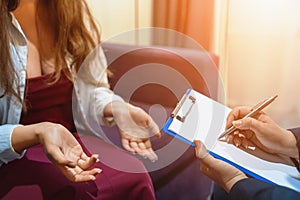 Psychologist or psychiatrist session with female patient, close up on hands, mental and psychology health treatment