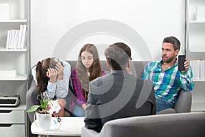 Psychologist with young couple, psychotherapist or marriage counselor listen mental health of couple and child. Father