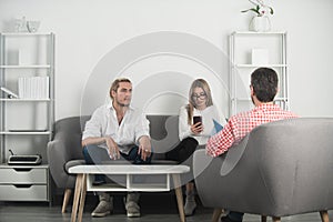 Psychologist with young couple, psychotherapist or marriage counselor listen mental health of couple. Psychological